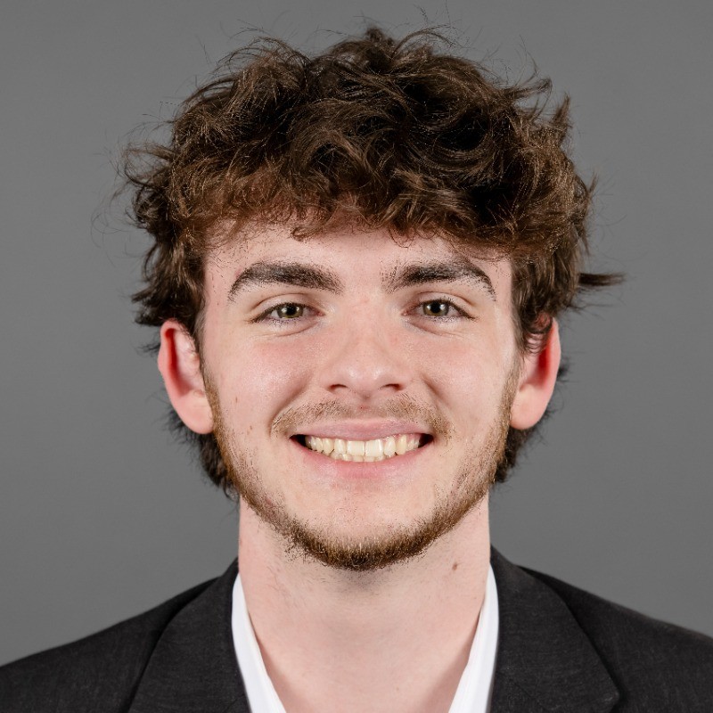 A professional portrait of Drew Meyer.